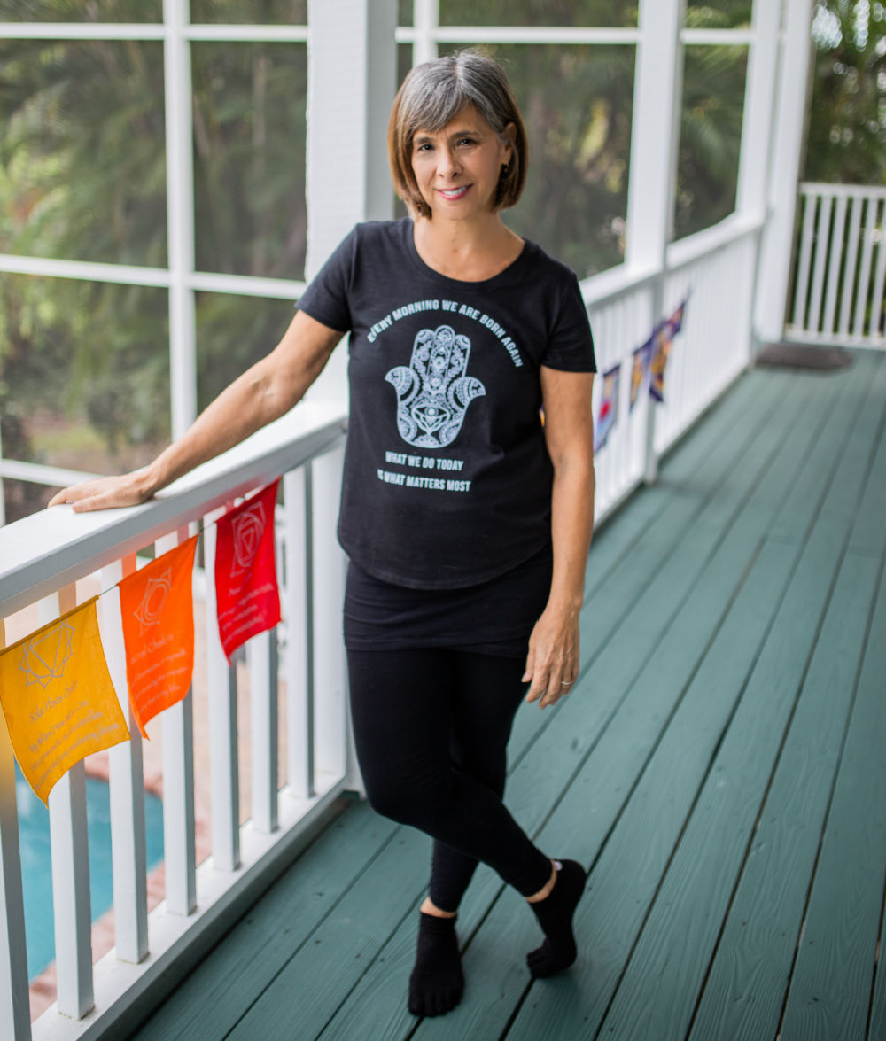 Andrea-looking-serious-yoga-deck-website (1)